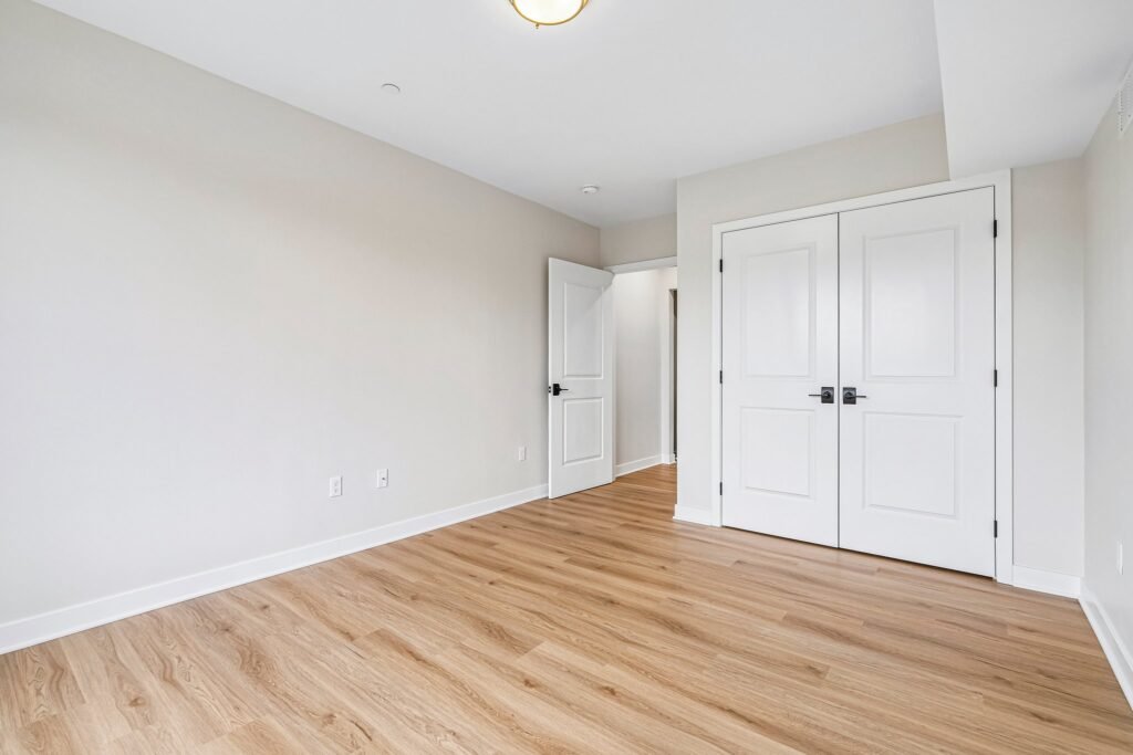 Bedroom with double closet and ceiling light