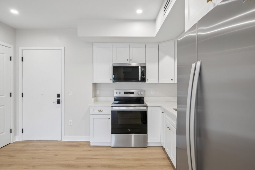 Kitchen with stainless range, microwave and refrigerator