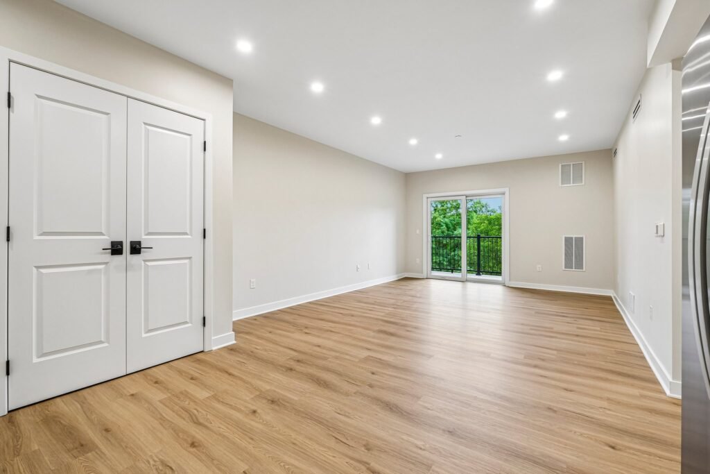 Living room with sliding glass door to a private balcony